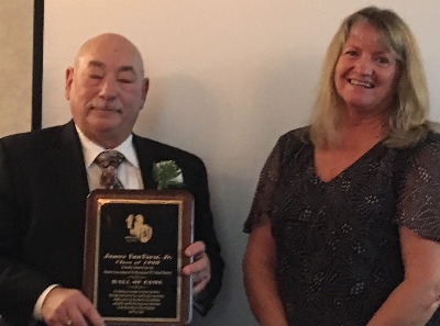 Beverly Ackerman presents award to Jim.